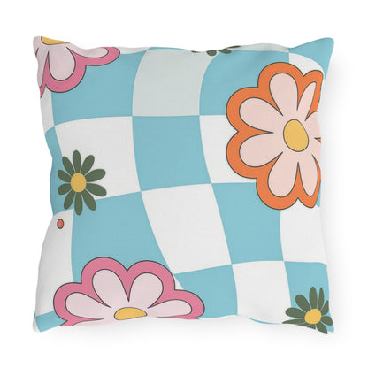Outdoor pillow with double-sided colorful flower design on wooden seat