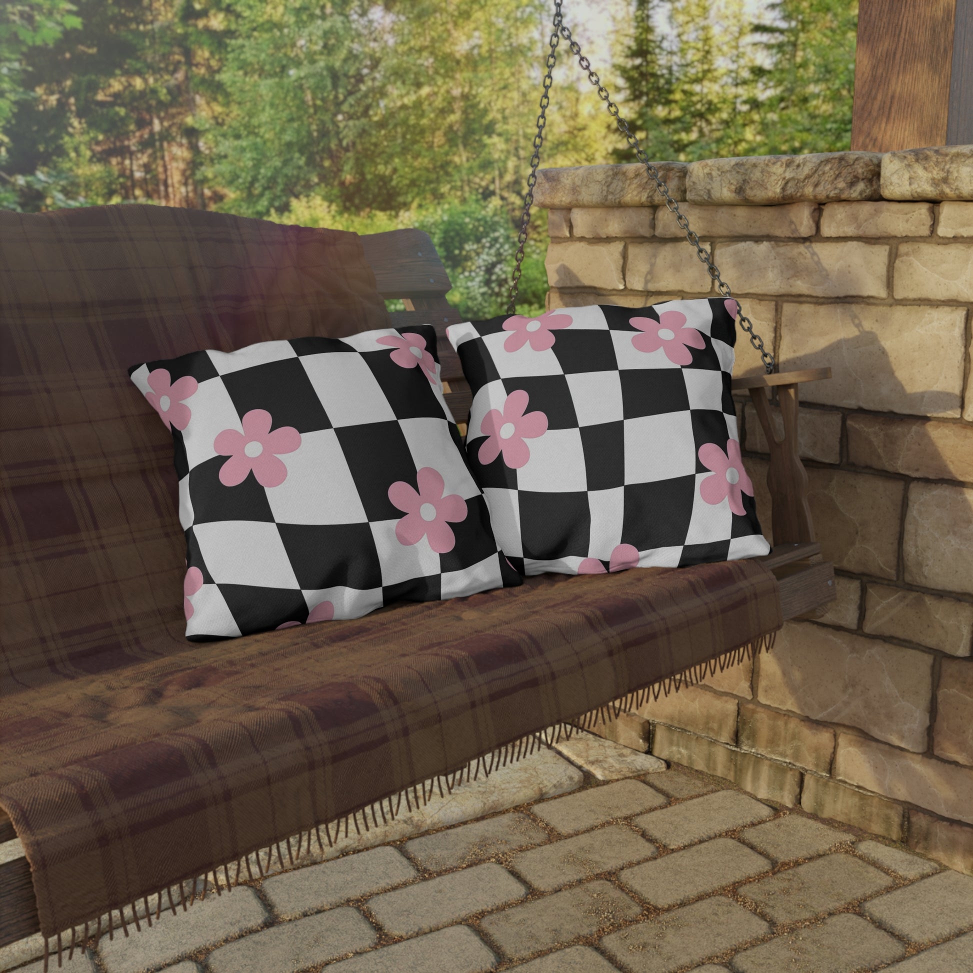 Soft and supportive outdoor pillow with pink blooms and geometric print for patio lounging