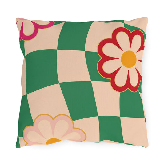 Floral outdoor pillow with pastel bloom print on a green background for garden furniture