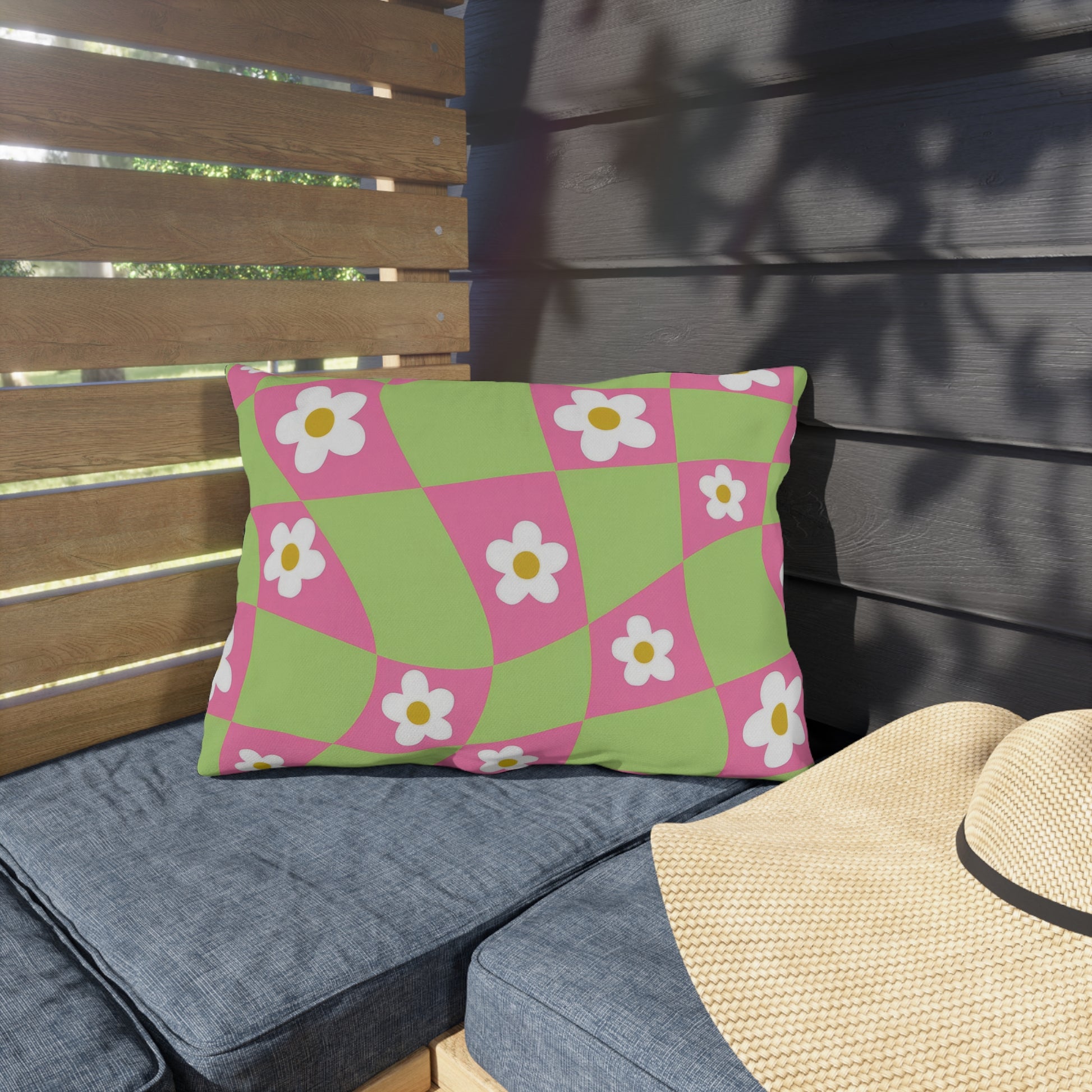 Soft patio pillow with orange, white, and pink flower print ideal for outdoor seating
