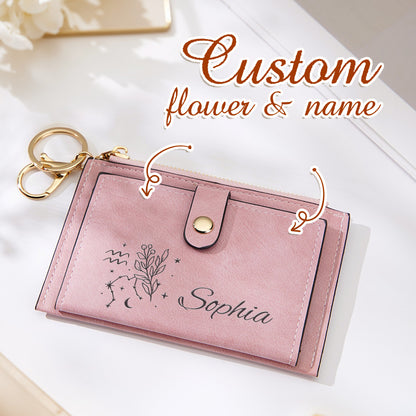 A close-up of the pink vegan leather wallet featuring an overlay indicating the option for personalized custom flower and name, a perfect personalized accessory for everyday style.