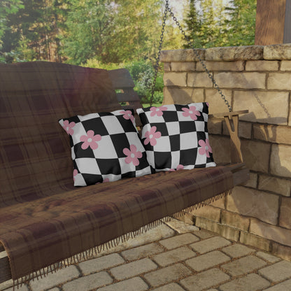 Modern floral pillow with pink flower accents and black grid for stylish outdoor use