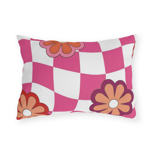 Retro floral outdoor pillow featuring a bright checkered pattern in pink, red, white, orange, and purple