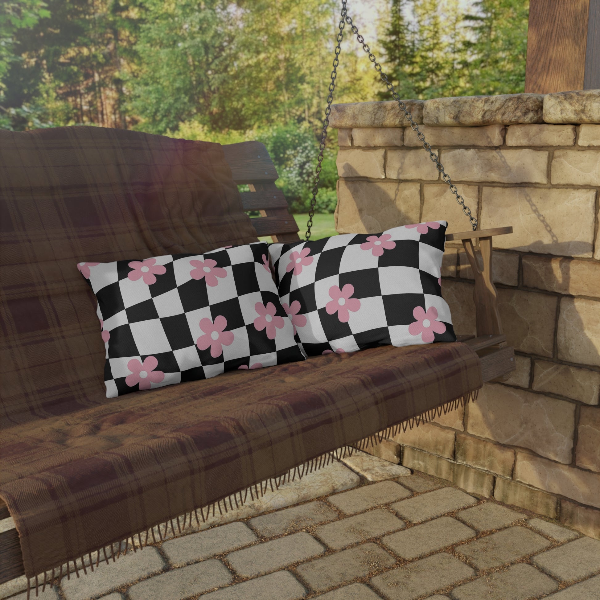 UV-resistant lumbar pillow with black and pink print styled for outdoor decor