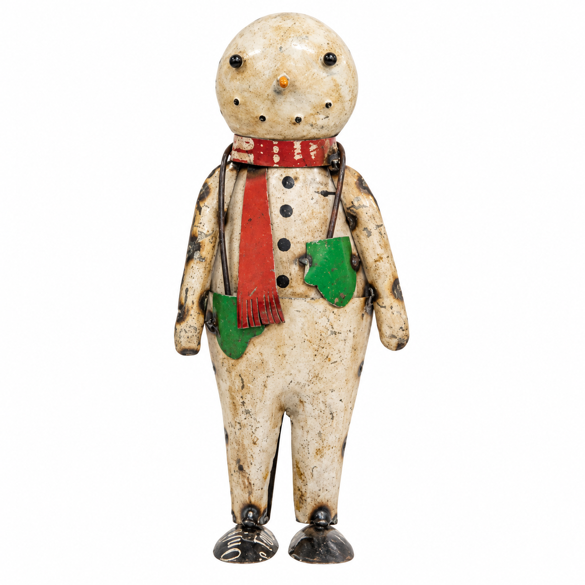 A vintage hand-painted tin snowman figurine with a weathered cream-colored body, black speckles, a red scarf, and green pockets, set against a plain white background.