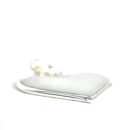 Elegant white shell necklace crafted in Taxco with traditional silverwork