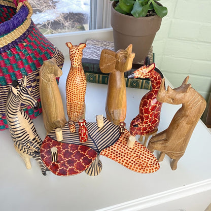 Handmade African wooden animal décor set, featuring rustic charm and fine craftsmanship for unique interior styling.