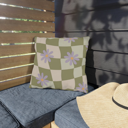 Square floral pillow accentuating patio furniture with vibrant blooms