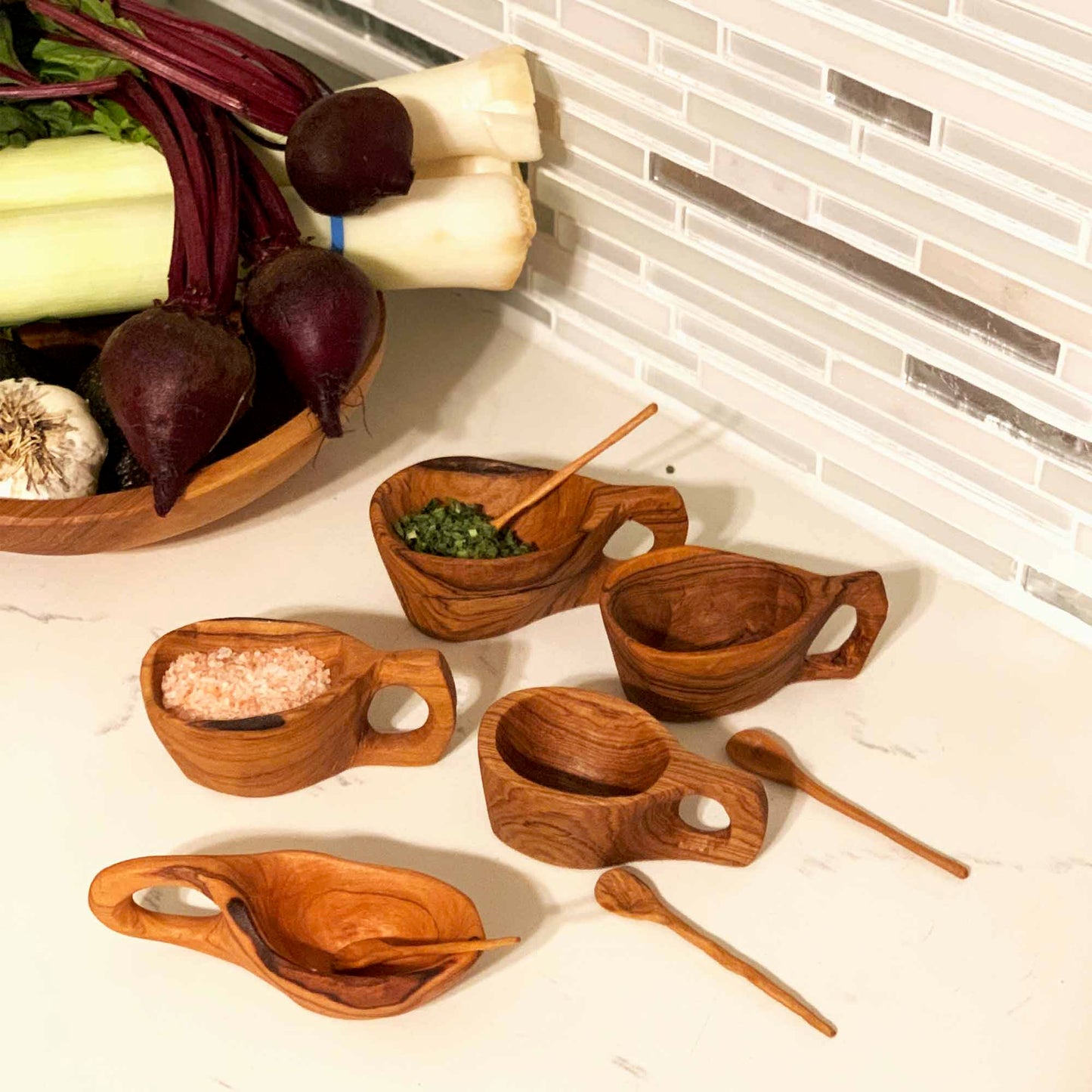 Kenyan olive wood salt pot, a unique and functional addition to any kitchen.