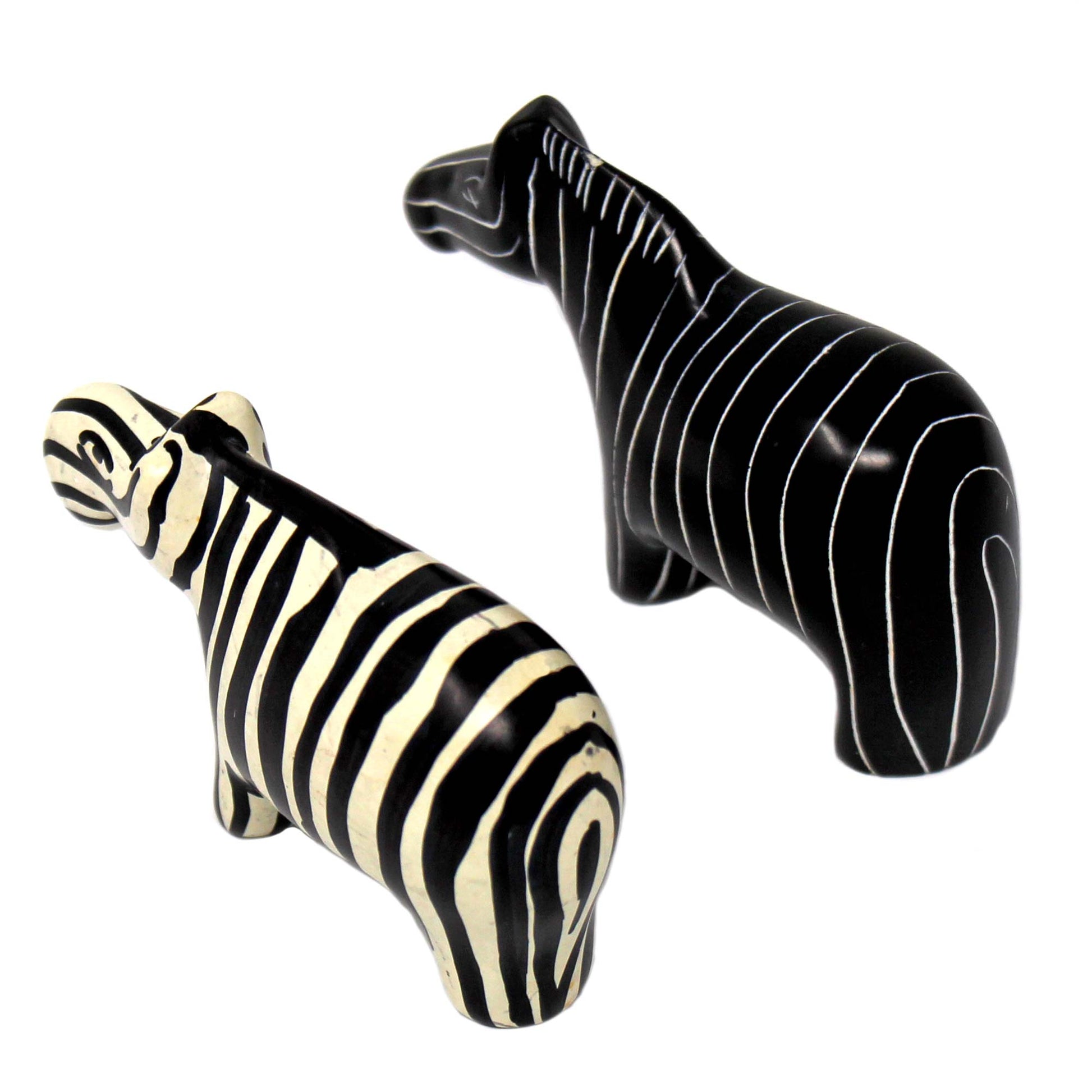 Natural and black striped zebra carvings made from solid stone