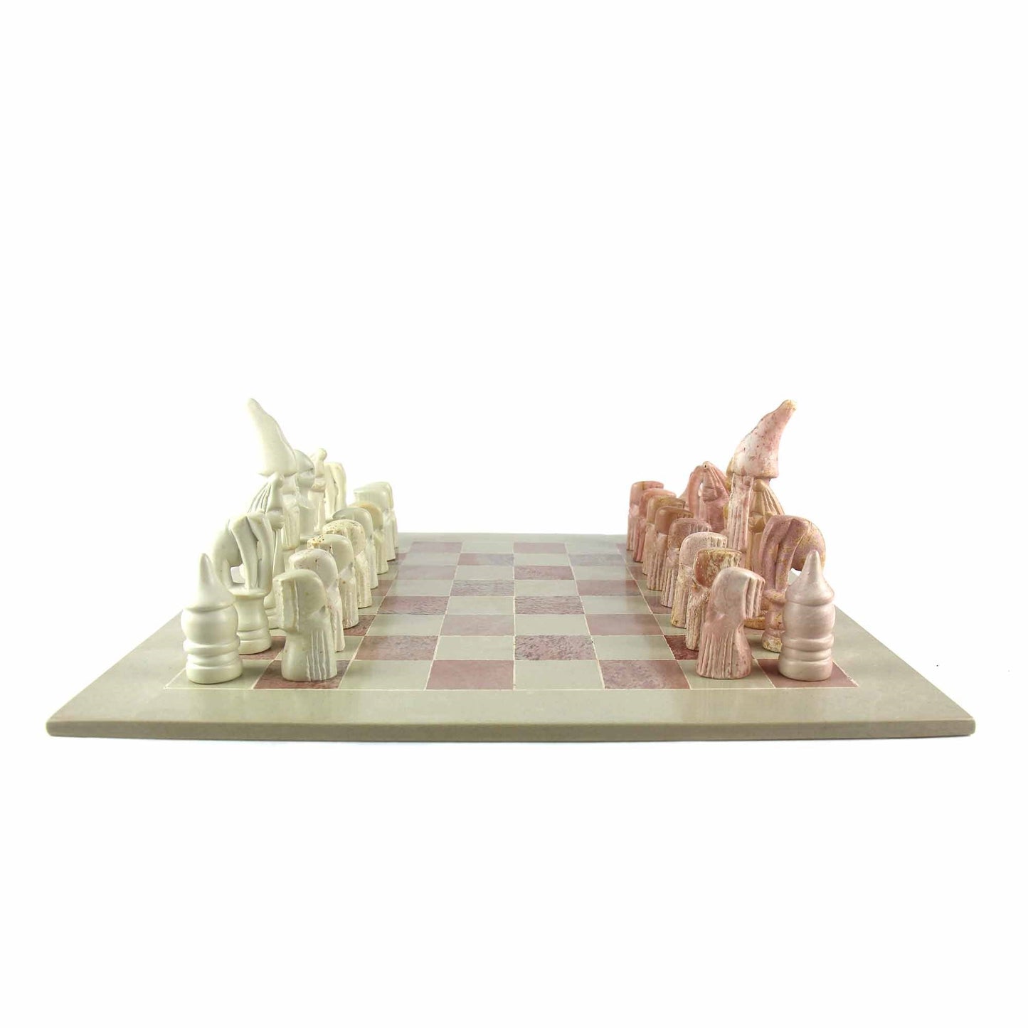 Fair Trade artisan chess set featuring intricately hand-carved soapstone pieces and a polished stone board.