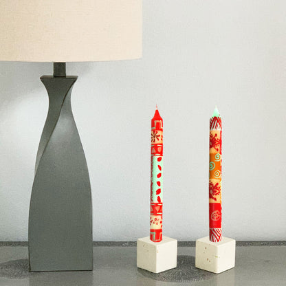 Close-up of individually painted African-style candles with geometric patterns