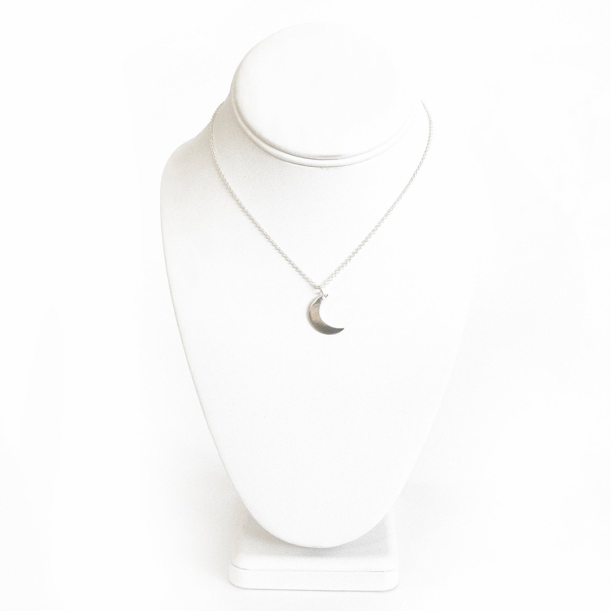 Delicately brushed silver crescent moon pendant on a minimalist chain, Fair Trade jewelry.