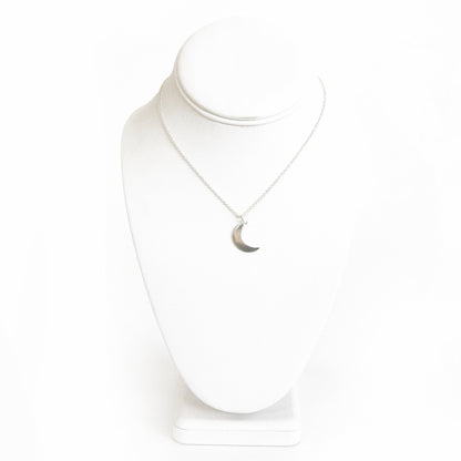 Delicately brushed silver crescent moon pendant on a minimalist chain, Fair Trade jewelry.