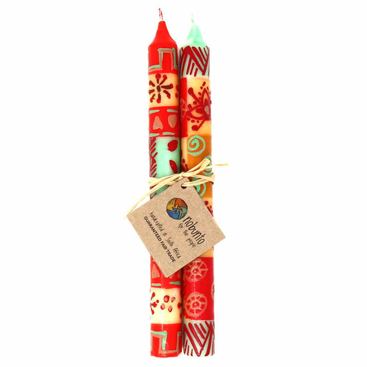 Hand-painted taper candles with traditional Owoduni design in earthy colors