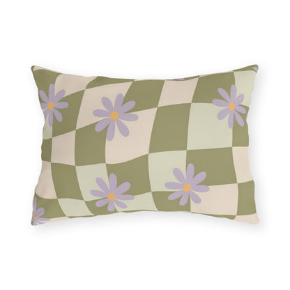 Floral outdoor lumbar pillow with green checkered background and bright garden-inspired blooms, styled for patio seating decor