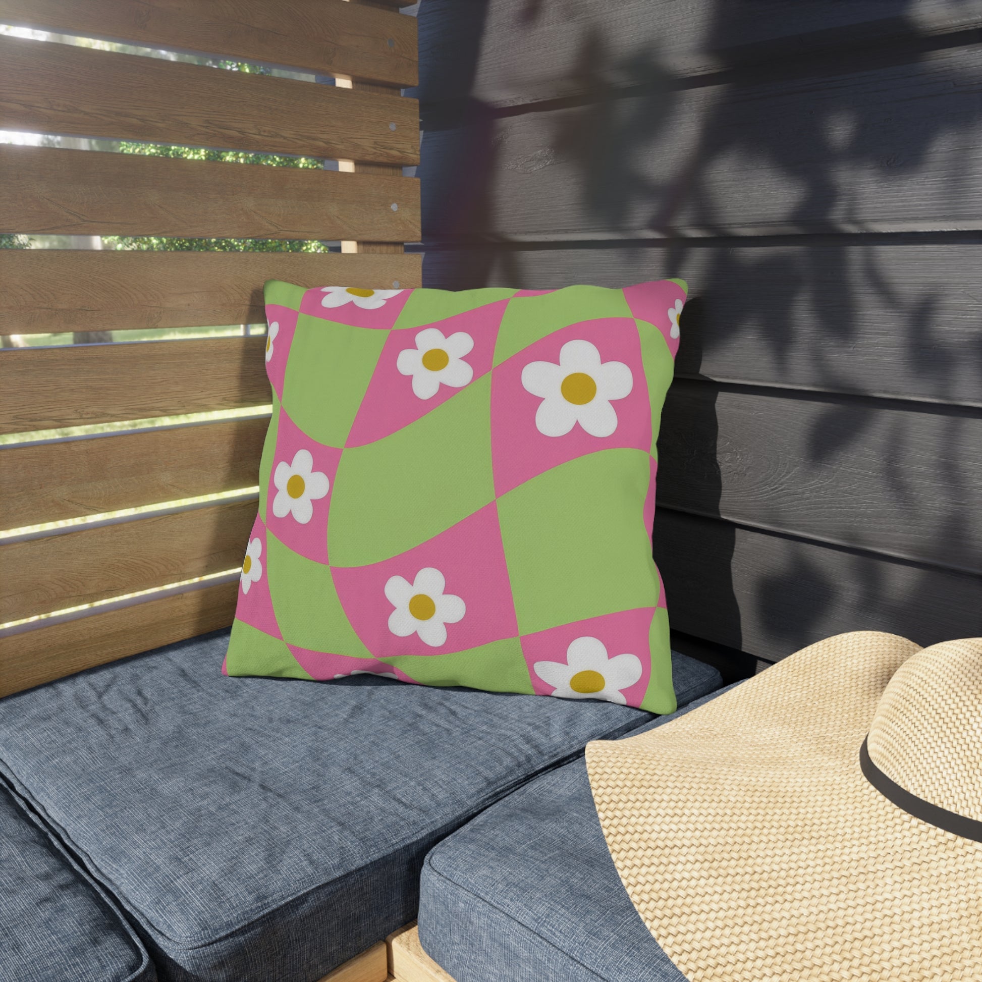 Outdoor floral cushion enhancing backyard decor with pink and orange flowers