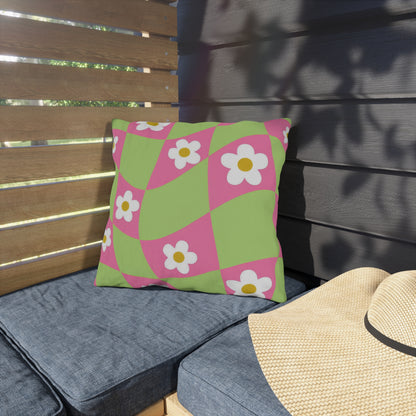 Outdoor floral cushion enhancing backyard decor with pink and orange flowers