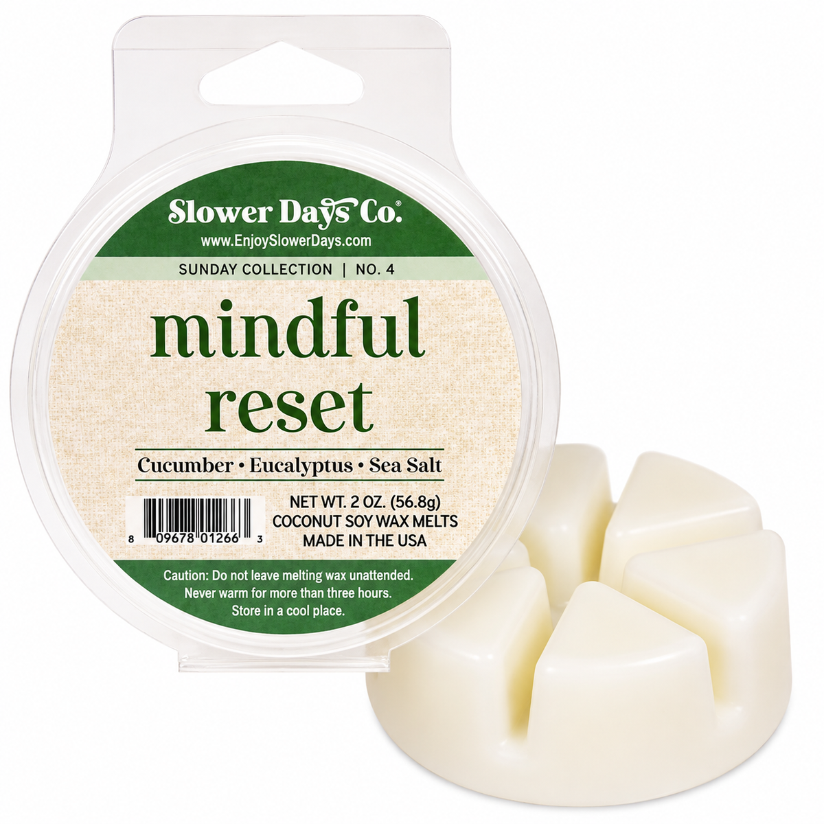 Slower Days Co. 'mindful reset' coconut soy wax melts in a clear round plastic tub with a green and beige label, shown next to three off-white wax melts on a white background.