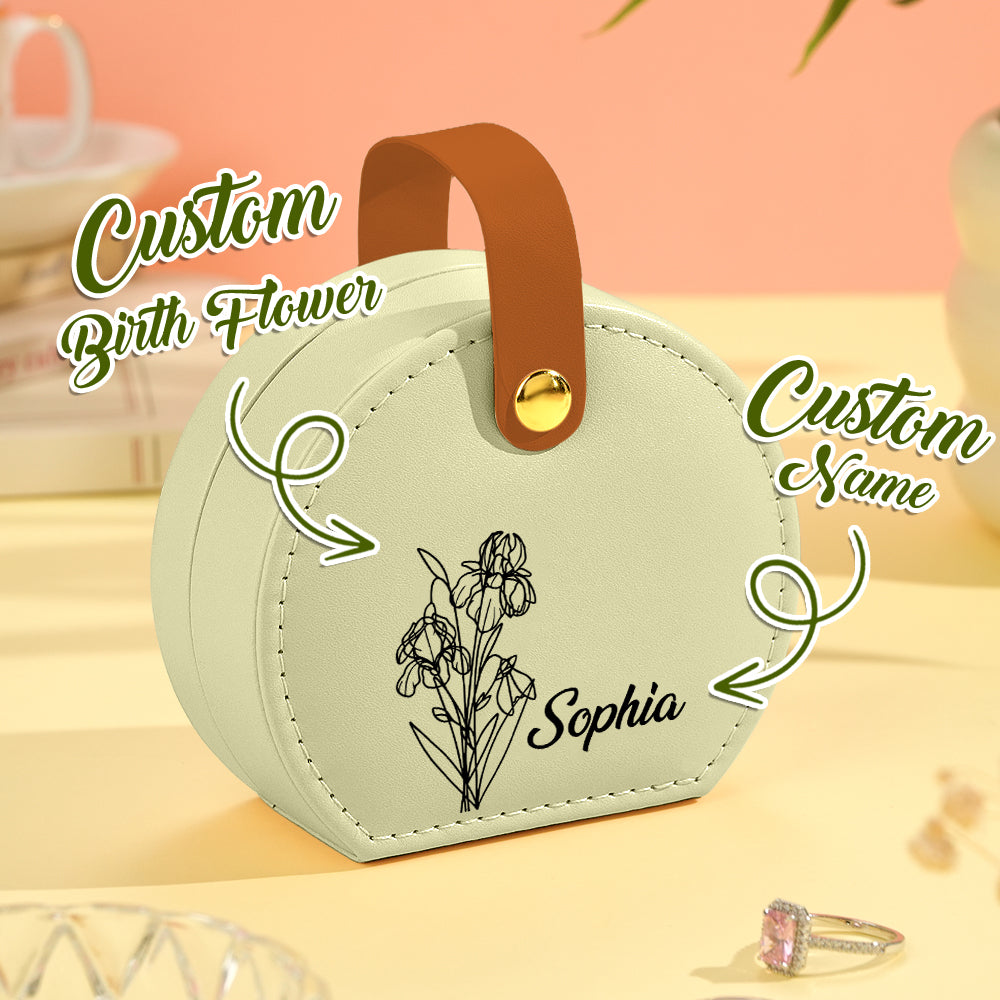 Close-up of a green birth flower jewelry box, highlighting the customizable name and engraved floral design on the soft PU leather exterior.