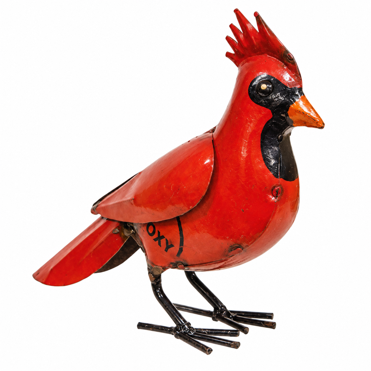 A vintage metal tin bird ornament shaped like a cardinal, featuring a bright red body with black painted accents, an orange beak, and black wire legs, shown against a plain white background.