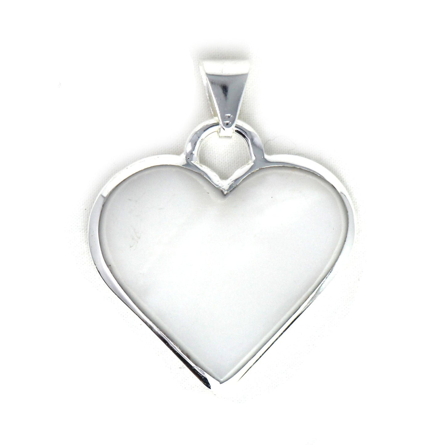 Jewelry box view of Mexican heart pendant with polished finish