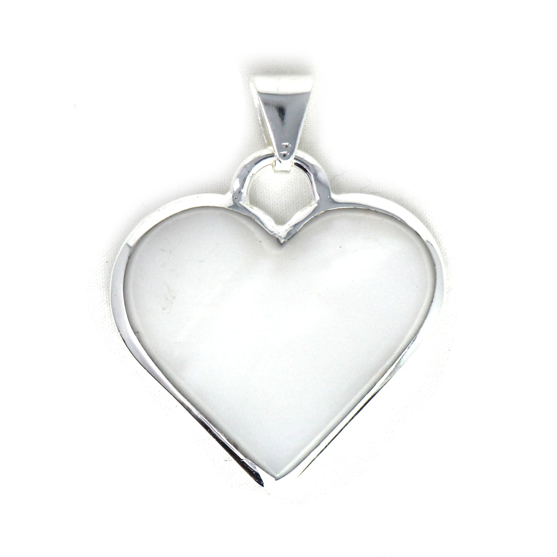 Jewelry box view of Mexican heart pendant with polished finish