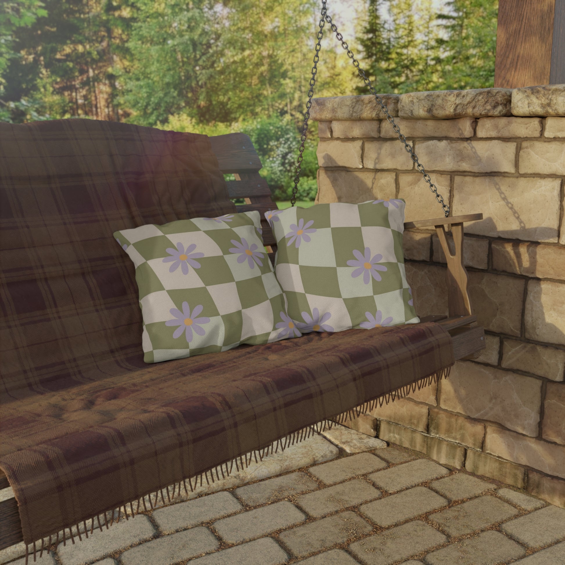 Outdoor decor cushion with cheerful flower design in soft hues