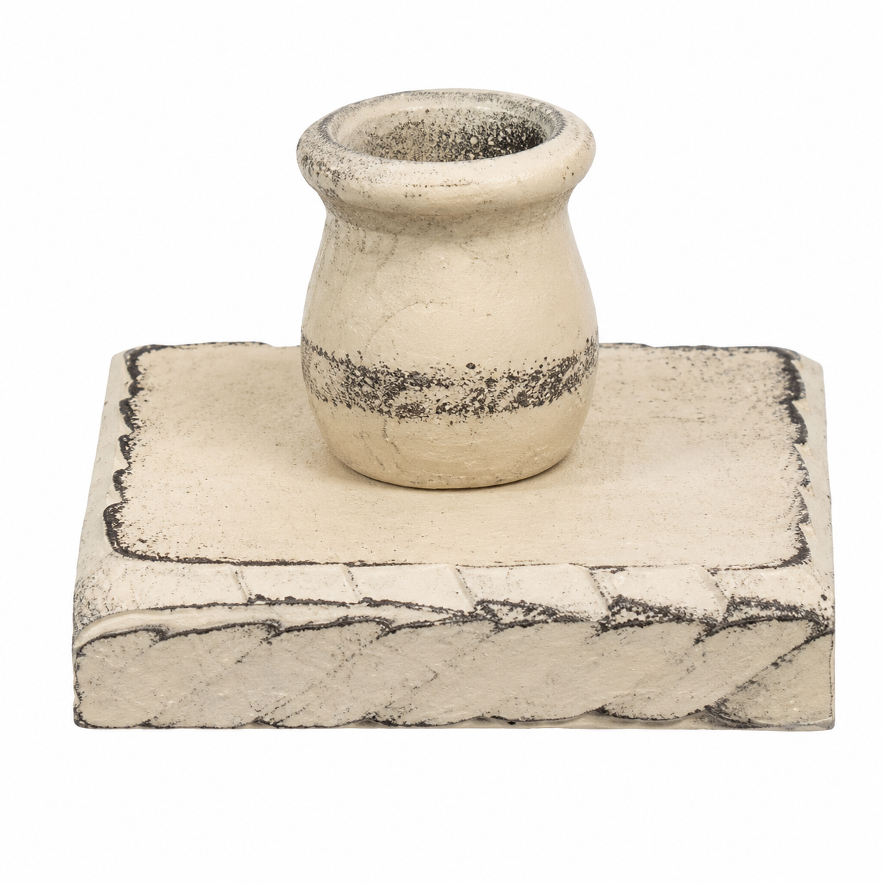 A rustic ceramic candle holder with a small cream-colored pot-shaped vessel sitting on a matching rectangular base, both featuring distressed black and gray detailing, set against a plain white background.