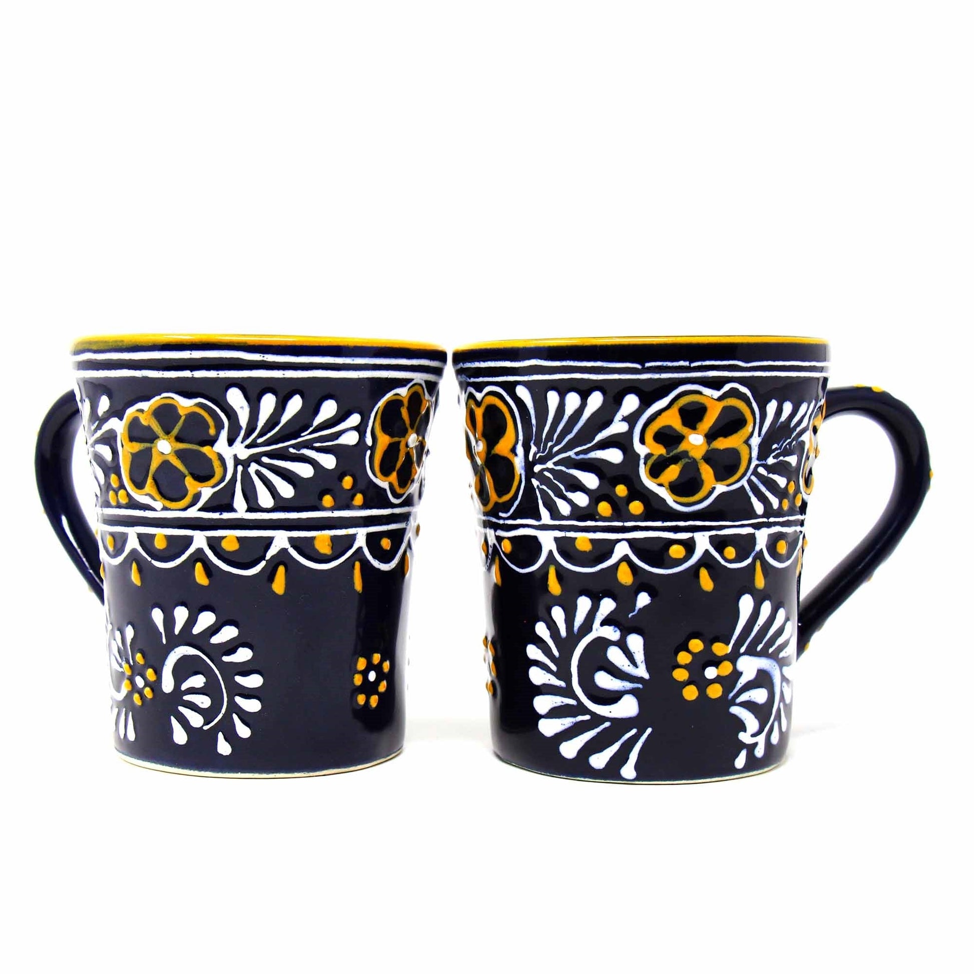 Close-up of blue ceramic mug showcasing hand-painted texture and traditional pottery craftsmanship from Mexico.
