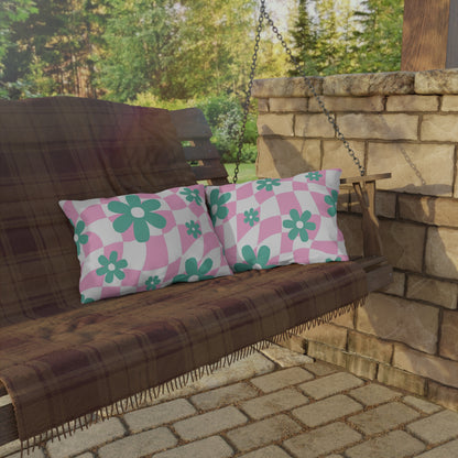 Cozy and colorful outdoor pillow featuring cheerful floral patterns, perfect for enhancing backyard spaces