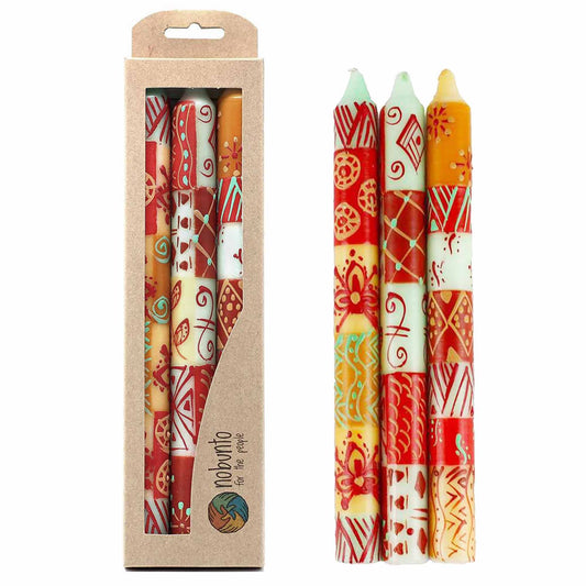 Set of three hand-painted taper candles in earthy Owoduni design, arranged in gift box