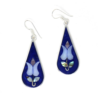 Close-up of natural abalone shell detailing in teardrop earrings