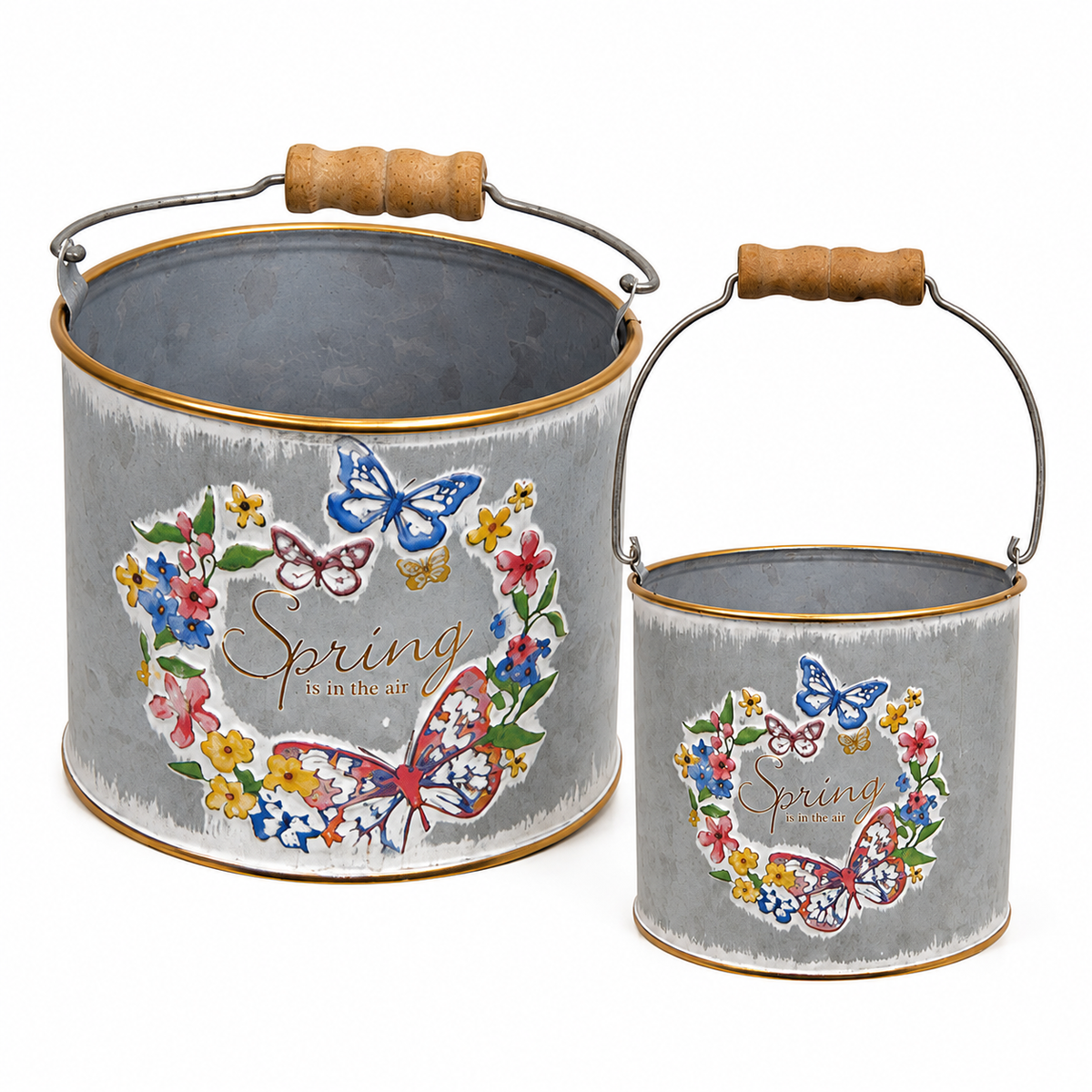 Small and large distressed metal flower buckets with colorful butterfly and floral designs styled with spring farmhouse-style décor.