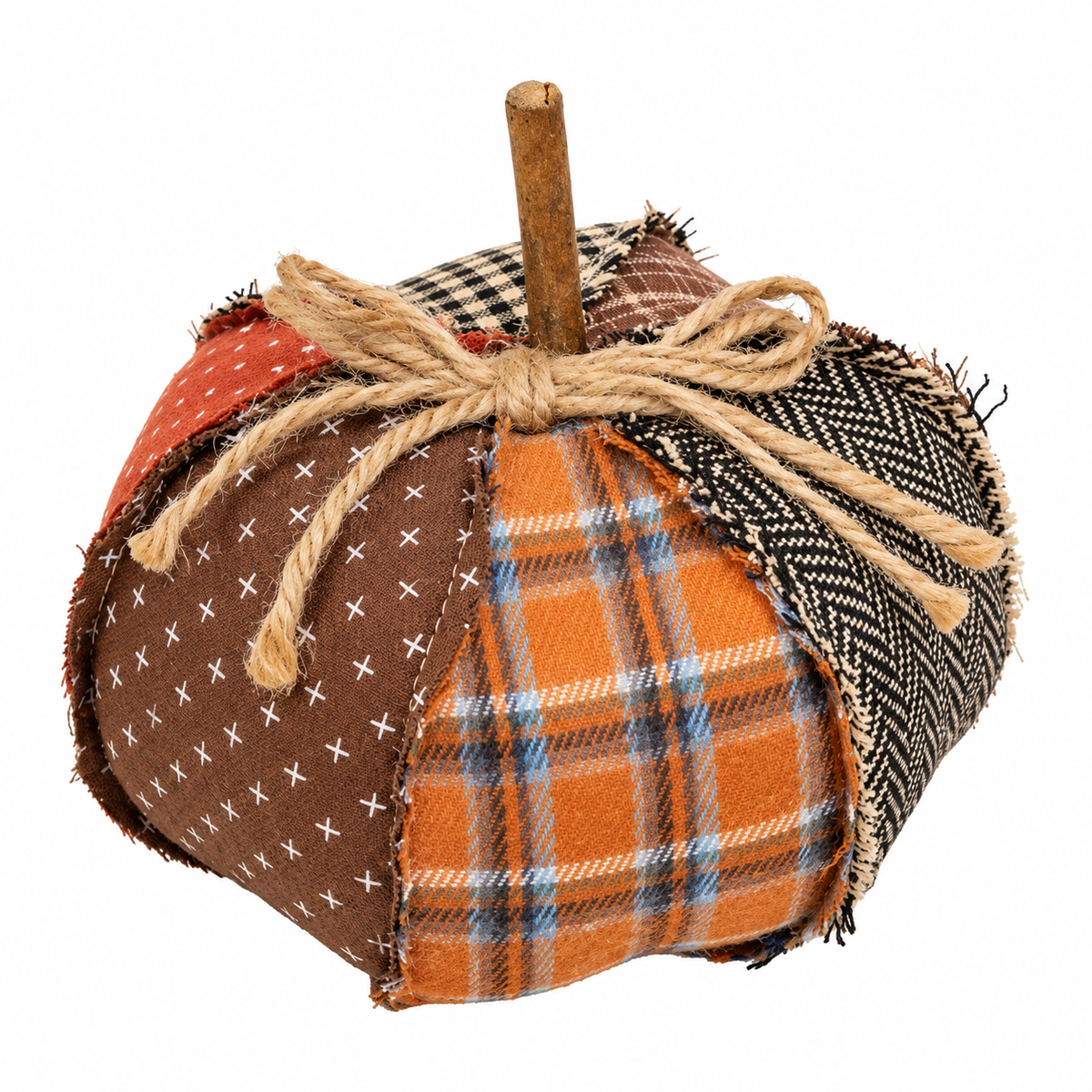 A handmade fabric pumpkin decoration with a wooden stem, featuring multiple patchwork panels in orange, brown, black, and white patterns, tied with a rustic jute rope bow, on a white background.