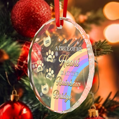 A close-up view of the Rainbow Bridge memorial ornament hanging from a Christmas tree, highlighting the raw edge of the glass and its personalized design as a tribute to a beloved pet.