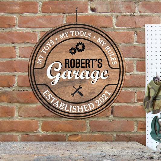 Round personalized garage wall sign with bold text and included hanging cord