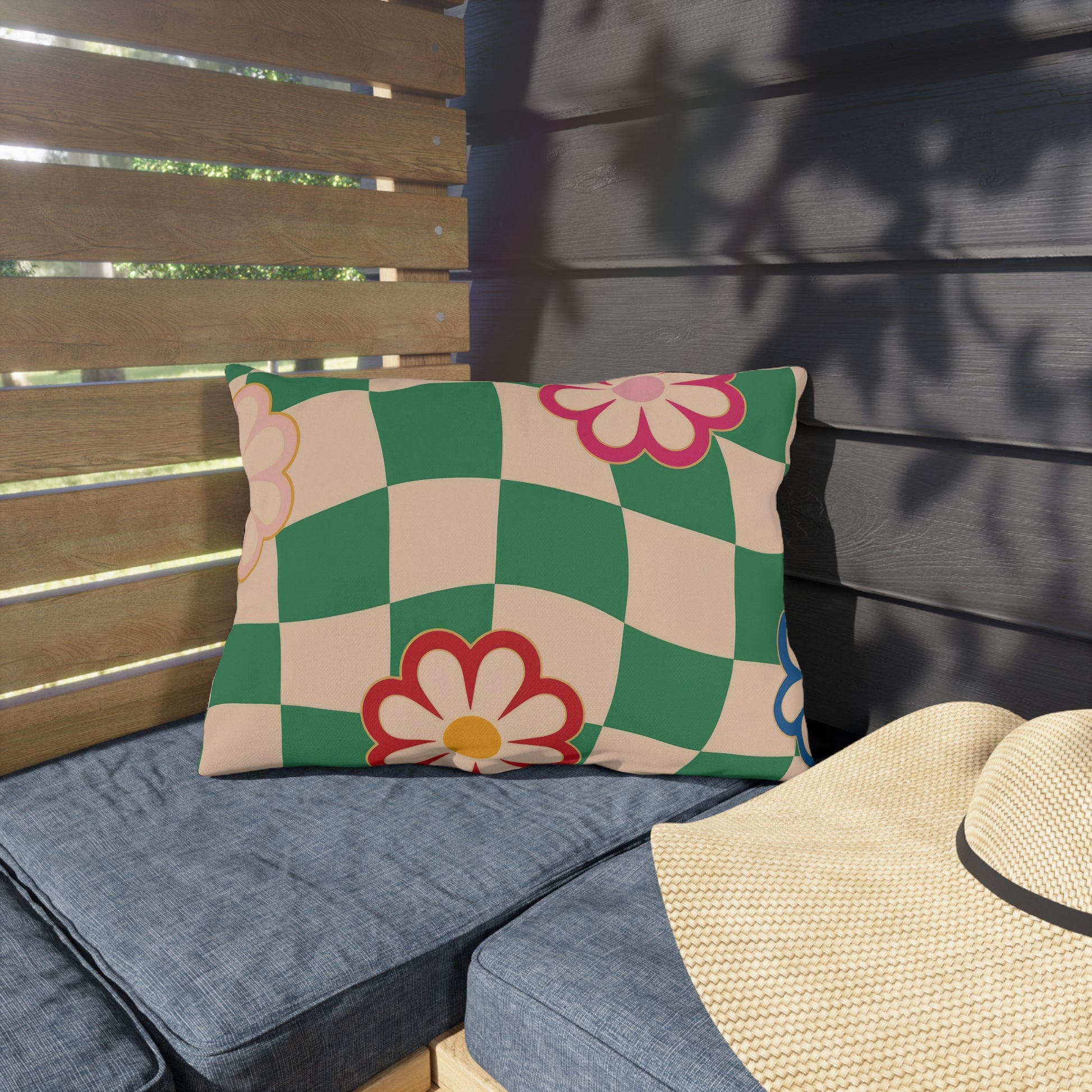 Bright garden pillow with vintage-style checkered backdrop, perfect for porches and balcony furniture
