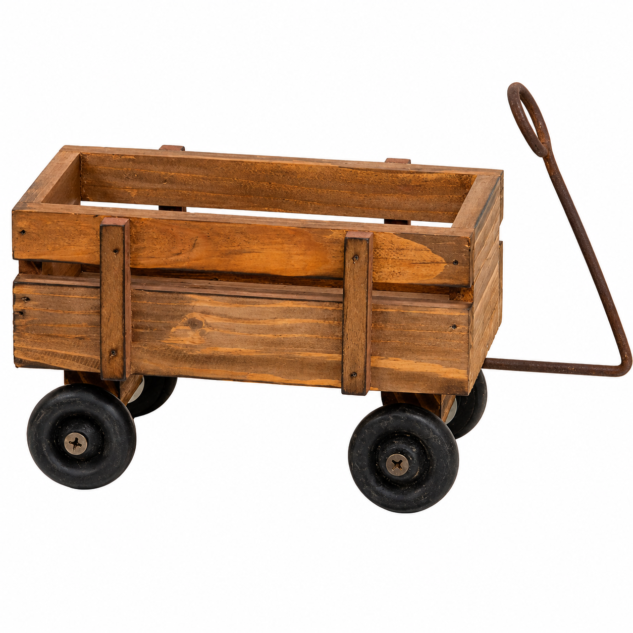 Small natural wooden wagon with medium brown finish, plank sides, four black wheels and a rusty metal handle.