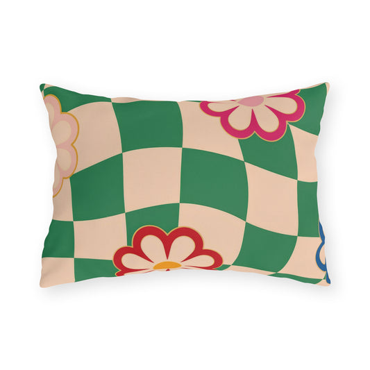 Rectangular floral lumbar pillow featuring a green checkered background with pink, red, blue, and yellow flower accents
