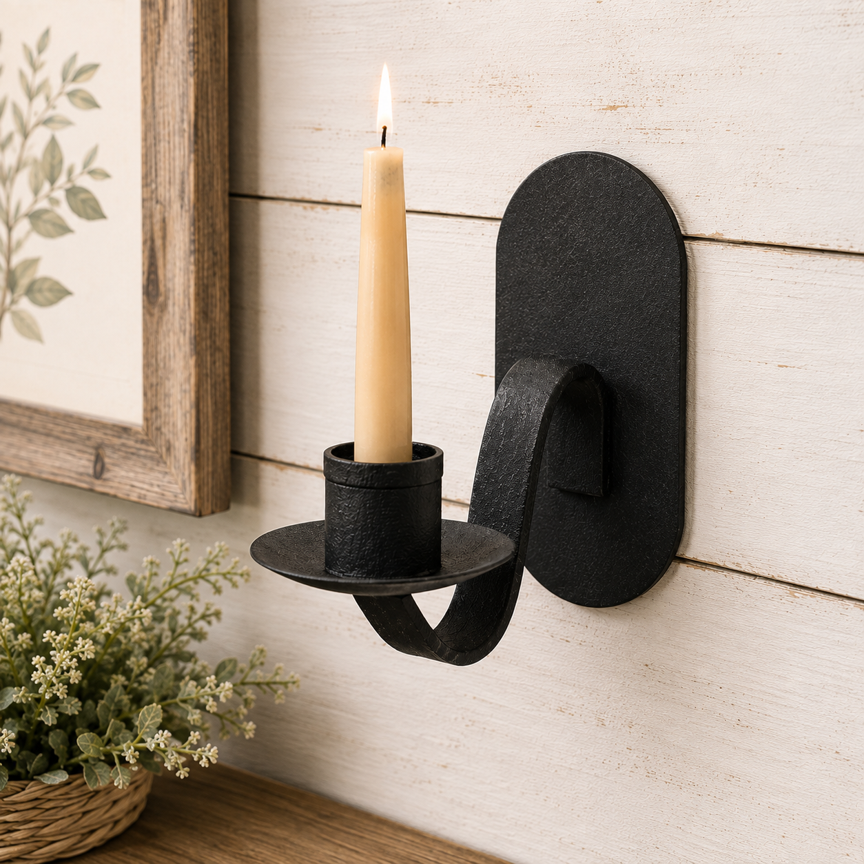 Black iron wall sconce candleholder with a compact profile and matte finish for farmhouse, country, and rustic wall decor.