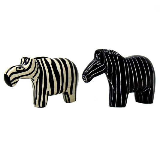Hand-carved soapstone zebra sculptures in black and natural tones