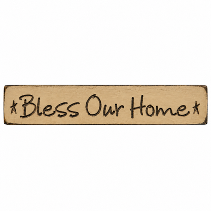 A rectangular wooden sign with the phrase '*Bless Our Home*' in dark lettering, shown on a plain white background.