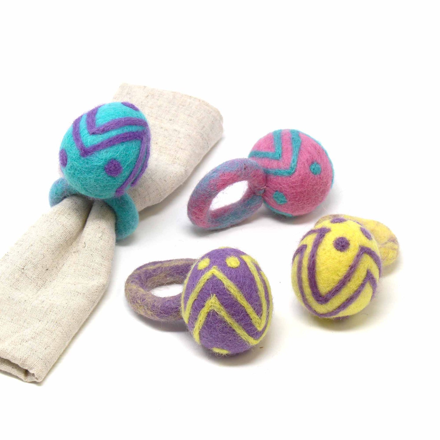 Handmade felt Easter egg napkin rings, colorful spring table decor, fair trade dining accessories, eco-friendly wool felt napkin holders, handmade in Nepal.