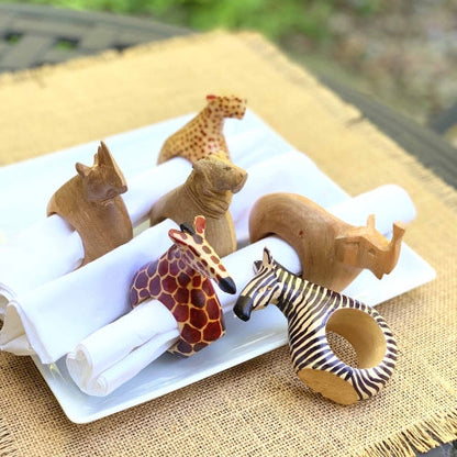 Elegant wildlife-themed table decor featuring handcrafted wooden napkin holders.