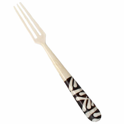 Close-up of intricate batik patterns on appetizer forks
