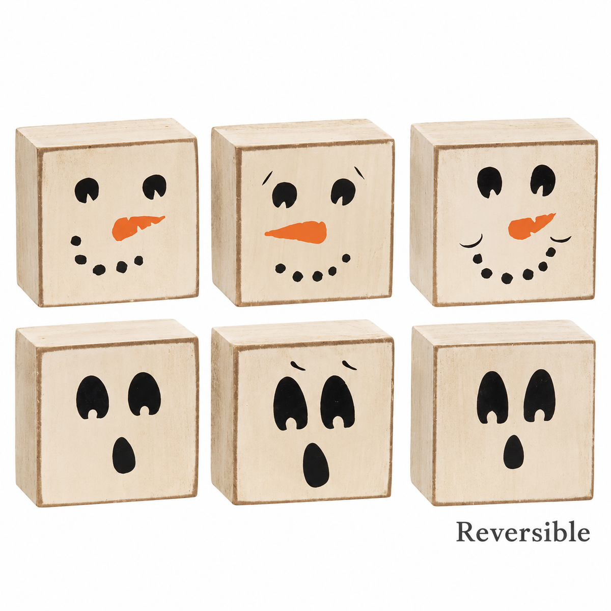 Six small square wooden blocks with painted faces, arranged in two rows on a white background. The top row shows snowman faces with black eyes, black dotted mouths, and orange carrot noses.