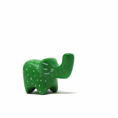 Artisan-crafted tiny elephant figurines, made from natural soapstone with marbled hues ranging from cream to black.