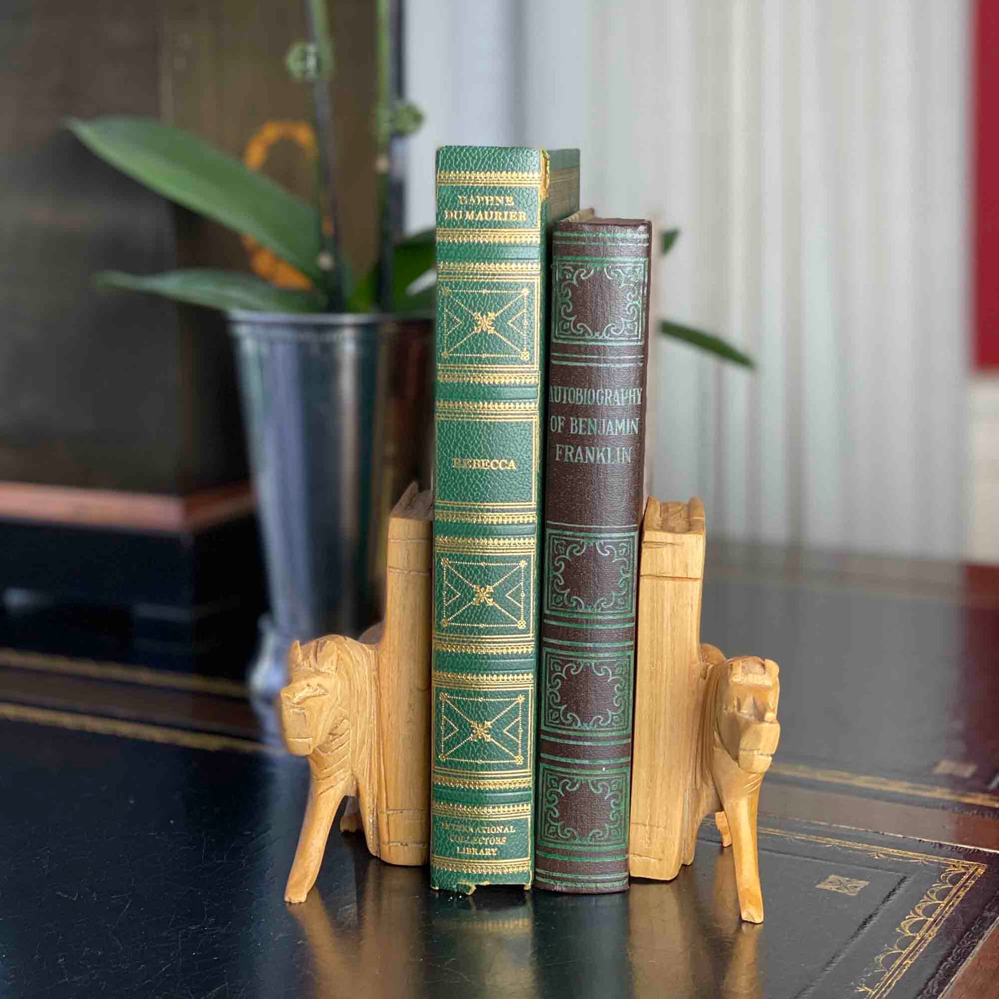 Bookends carved from jacaranda wood with lion design