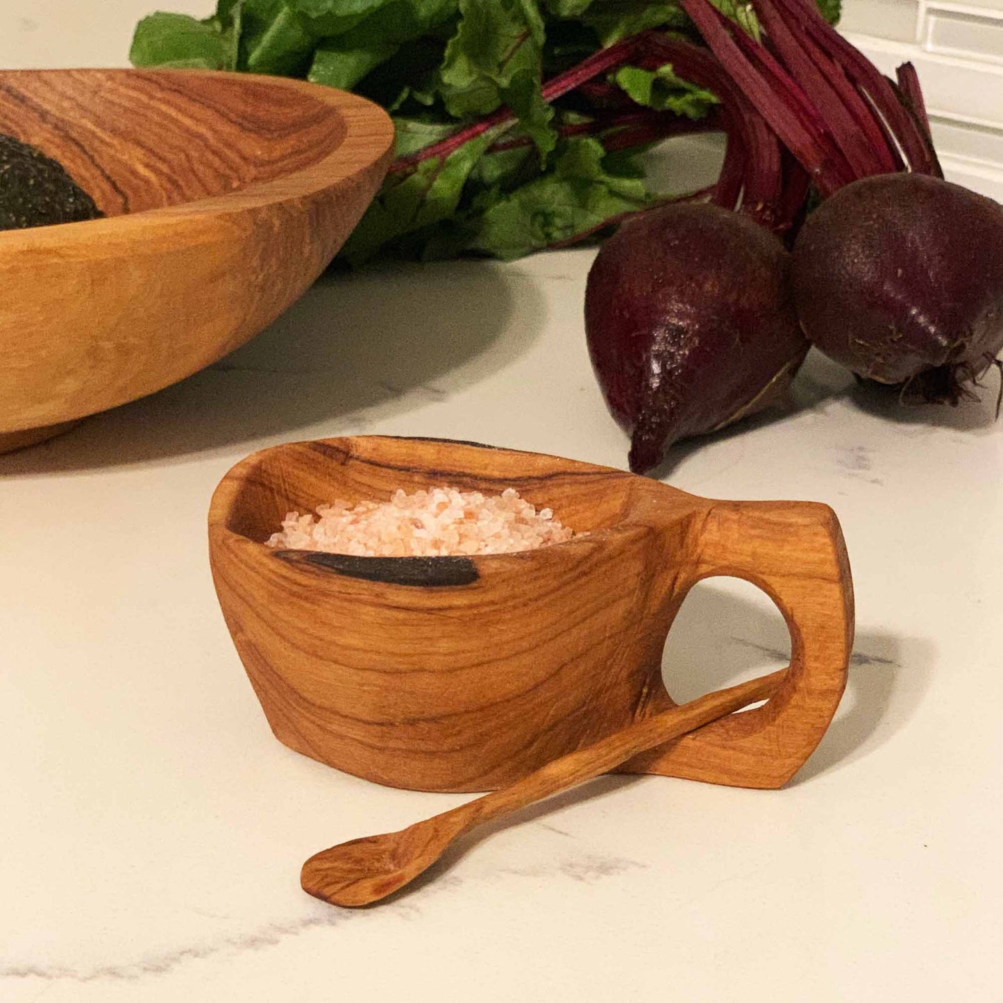 Small-batch artisan salt cellar made from sustainably harvested olive wood.